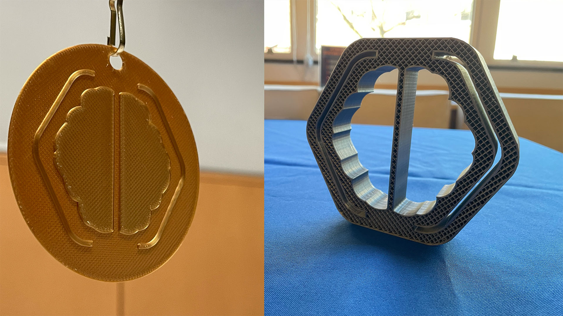 Two 3D prints of the CuseHacks logo.